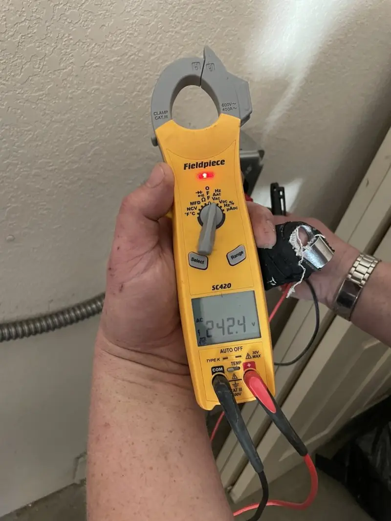 Voltage testing with clamp meter during Recessed Lighting Installation in Rhinebeck